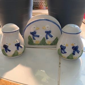 Salt, pepper shakers with matching napkin holder.